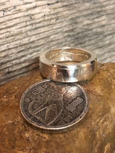 This Egyptian .999 Pure Silver Round Half Double Sided Coin Ring Is Hand Crafted with Great care and detail. This Awesome item is very unique and each individual Ring will be different due to the Crafting process. Please contact us with your preferred finish in the remarks of your order- either Antiqued Patina or High Silver Polish. We also offer this ring in sizes 6 to 12; which you can choose as you are completing your purchase. This Collectable is Silver It will not cause discoloration; Howev Round Sterling Silver Etched Rings, Etched Sterling Silver Rings, Silver Etched Round Ring, Unique Engraved Round Ring, Unique Engraved Ring With Polished Finish For Anniversary, Unique Engraved Rings For Anniversary, Silver Stamped Rings, Unique Stamped Rings For Anniversary, Egyptian Cat