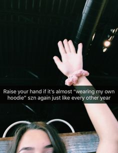 a woman holding her hand up in the air with text above it that reads raise your hand if it's almost wearing my own hoodie's again