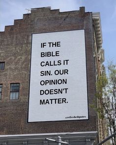 a billboard on the side of a building that says if the bible calls it sin, our opinion doesn't matter