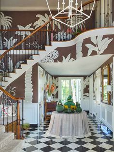 the foyer is decorated in shades of brown and white