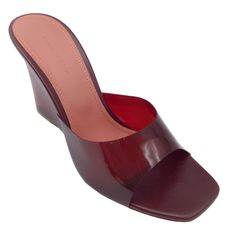 Description: Amina Muaddi Burgundy Lucite Wedge Sandals. Condition: Never Worn *Although These Shoes Are In Brand New Condition, They May Have Minor Scuffs On The Soles Or Exterior Marks From In-Store Try On. Please Refer To Photos. Material: Plastic Includes: N/A Country Of Origin: Italy *Please Note, As With Most Shoes Made In Italy, These May Run Small. Heel Height: 4" Sole: Leather Hardware: N/A Color: Burgundy Size: Us 9.5 / It 39.5 Category: Shoes Subcategory: Sandals Sub Sub Category: San Closed Toe Wedge Sandals With Deep Heel Cup, Luxury Summer Wedge Sandals With Wrapped Heel, Luxury Wedge Sandals With Padded Heel, Luxury Summer Wedge Sandals With Block Heel, Party Wedge Slip-on Sandals, Party Slip-on Wedge Sandals, Elegant Closed Toe Wedge Sandals, Elegant Red Wedge Sandals For Summer, Chic Wedge Sandals With Deep Heel Cup