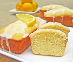 a white plate topped with slices of lemon cake