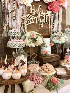 a table topped with lots of cakes and desserts