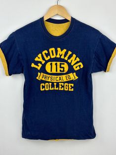 Amazing double side phys ed collegiate tee. Beautifully worn-in. Great condition Collegiate Screen Print Top For Campus, Collegiate Style Screen Printed Tops, Collegiate Style Screen Print Tops For Campus, Sporty Pre-shrunk T-shirt For Campus, Collegiate Apparel, Collegiate Letter Print T-shirt For Campus, Collegiate Cotton T-shirt For Campus, Varsity Graphic Print T-shirt For Campus, Collegiate Aesthetic