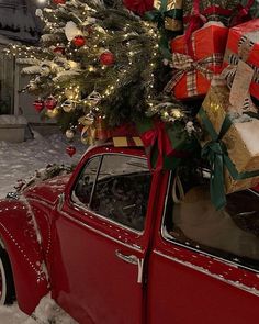 an old red car with presents on top