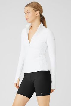 Fitted and ready for making moves. The Alosoft ½ Zip Rapid Pullover, made from velvety soft & breathable Alosoft, features invisible side zip pockets and elevated seams that contour the body for a perfect fit. Take it to the pavement with Alo performance leggings. ½ Zip, ultra-contouring pullover Velvety, breathable Alosoft Designed & uniquely fit to flatter every size Wear-tested by our in-house team for the perfect fit Sporty Half-zip Tops For Layering, Functional White Half-zip Top, Alo Yoga Fitted Tops For Winter, Alo Yoga Long Sleeve Workout Tops, High Stretch Solid Color Tops By Alo Yoga, White Long Sleeve Alo Yoga Top, Alo Yoga Fitted Long Sleeve Activewear, Alo Yoga Long Sleeve Athleisure Activewear, Alo Yoga Long Sleeve Activewear For Sports