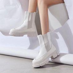 Step out in style with The Catching Eyes Boots. The classic Chelsea boot reimagined with an oversized platform, the boot has a clean and minimalistic design, made of super soft vegan leather, featuring a round toe, back tongue, and elasticated panels that make them so easy to pull on and off, finished with slip & abrasion-resistant rubber sole. Wear them with jeans or floaty dresses. PLEASE measure your foot and refer to our Size Chart so that you can get the right size. These boots run small, s Floaty Dress, White Boots, Minimalistic Design, Puma Fierce Sneaker, Stepping Out, Chelsea Boot, Black Boots, Chelsea Boots, Minimalist Design