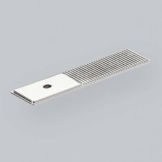 a metal comb on a gray background