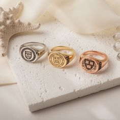 Celebrate your high school or College journey with a custom Signet Ring! Customize the university crest, class emblem, and other logo designs on the front of the ring. You can also engrave the year and other special words on the ring band, as well as add your name inside the ring. To create a one-of-a-kind piece that reflects your unique experience and will remind you of your  school experience for years to come.. Whether you're looking for a stylish accessory or a meaningful graduation Gifts, this personalized ring is the perfect way to commemorate your time in high school or college . This will be a perfect graduation gift! Our jewelry pieces come equipped with everything you need for gifting, a gift box included with every purchase at no additional cost. --How to Order-- [In Drop Down M Signet Ring Men Family Crest, Meaningful Graduation Gifts, Family Crest Ring, College Ring, Family Crest Rings, School Rings, College Rings, Custom Signet Ring, Graduation Rings