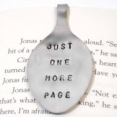 a spoon with the words just one more page on it