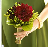 a woman holding a bouquet of flowers in her hands