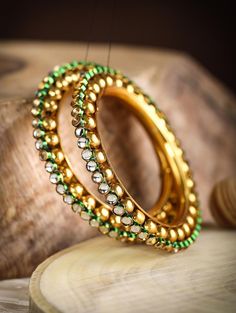 Silver Gold Plated Bangle colour Available Yellow Gold ,White Gold ,Rose Gold plating bangles 2 Bangle Set Gemstone Kundan Bangle size available 2-4,2-6,2-8. Happiness looks gorgeous on you, and you must wear it all the time. One way to do it is with the Green Kundan Gold Plated Set of 2 Bangle Set. Crated in the traditional style, these bangles are gold-plated and have the classic design of kundan studded circles placed one after another to embrace your wrists with elegance. With its green outl Bracelet For Girls, Kundan Bangles, Gold Plated Bangles, Recycled Silver, Bangle Set, Bangles Jewelry, Set For Women, Plate Sets, Bangle Bracelet