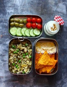 three containers filled with different types of food