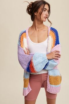 The Hand-Knit Multi-Striped Cardigan is a cozy and eye-catching layer that effortlessly combines warmth with style. Crafted with meticulous hand-knitting, this cardigan features a vibrant array of stripes, adding a playful and dynamic touch to your outfit. Whether you're layering it over a simple tee or dressing it up for a more polished look, this cardigan is a versatile and fashion-forward choice for any occasion.Model is 5' 7" wearing a size Small Fabric Contents: 100% Acrylic Stretch fabric Striped Delight, Core Outfits, Boho Whimsical, Nostalgia Core, Maria Grazia, Simple Tees, Whimsical Fashion, Yarn Projects, Striped Cardigan