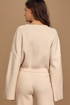 The Lulus Snuggly Style Cream Ribbed Knit Cropped Sweater is on the top of our must-have list! Cozy ribbed knit makes up this cute sweater with a rounded neckline, drop shoulders, and long wide sleeves that offer that perfect slouchy look. Relaxed-fit bodice ends in a cropped hem, perfect to wear with high-waisted bottoms. Pair with the matching pants for a complete look! Fit: This garment fits true to size. Length: Size medium measures 18.5" from shoulder to hem. Bust: Great for any cup size. Waist: Loosely Fitted. Undergarments: May be worn with any standard bra. Fabric: Fabric is very stretchy. Unlined. 55% Viscose, 28% Nylon, 17% Polyester. Hand Wash Cold. Do Not Bleach. Line Dry. Iron Low Heat. Imported. Lulus | Snuggly Style Cream Ribbed Knit Cropped Sweater | Size Small. Fall Cropped Sweater With Ribbed Neckline For Loungewear, Ribbed Cropped Sweater For Fall Loungewear, Cozy Ribbed Cropped Sweater For Loungewear, Spring Ribbed Crew Neck Sweater, Ribbed Crew Neck Sweater For Spring, Ribbed Crew Neck Spring Sweater, Ribbed Cozy Fit Top For Fall, Cozy Fit Ribbed Top For Fall, Cozy Cable Knit Tops For Loungewear