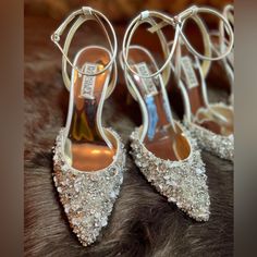 the bride's shoes are adorned with swaroza crystals