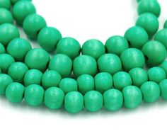 the beads are green and there is no image in this page to describe, they look like