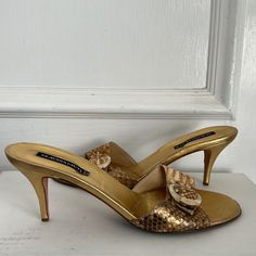 Never Worn. Size 9.5. Cocktail Open Toe Heels With Buckle Closure, Gold Almond Toe Heels With Heel Loop, Designer Almond Toe Heels With Buckle Closure, Chic Gold Almond Toe Sandals, Vintage Pointed Toe Sandals For Party, Gold High Heel Mules For Cocktail, Party Mules With Buckle Closure And Round Toe, Almond Toe Sandals With 4-inch Heel For Cocktail, Cocktail Sandals With 4-inch Heel And Almond Toe