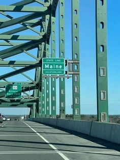 the highway sign is clearly visible for all of us to see on this bridge overpass