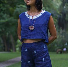 "Blue Indigo Tie Dye Sleeveless Top for Women 100% Double gauze cotton. Indigo natural dye with tie-dye detail on the side. Sizing: Made in one size to fits XS to M / US: 2/4/6/8 Measurement; Chest up to 37'' Pit to pit across 19'' Length top to bottom 15\" Armhole 18'' around. **Model is a size US 6 with 33\"bust 36\" hip. 164 cm tall.** Description: 100% Double Gauze cotton. Very soft and comfy. Indigo natural dye. With tie-dye detail on the sides. Simple round neck with a small slid in the mi Indigo Sleeveless Top For Spring, Sleeveless Indigo Tops For Spring, Sleeveless Cotton Tops With Natural Dye, Sleeveless Cotton Top With Natural Dye, Blue Cotton Sleeveless Tank Top, Blue Cotton Sleeveless Top, Casual Sleeveless Top With Natural Dye, Casual Sleeveless Eco-friendly Top, Blue Tops With Natural Dye