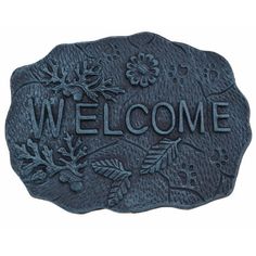 a welcome sign with flowers and leaves on the front, is shown in black cast iron