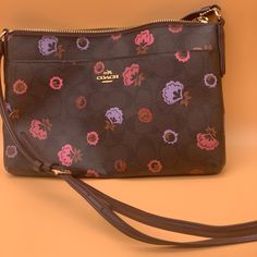 -New And Never Used -Purchased At Coach -Pink And Purple Floral Crossbody Purse/Bag -Have You Been Searching For This One?!Complete Your Collection! -Smoke, Pet, And Fragrance-Free Home! -Fast Shipping! Same-Day Shipping Is Available Before 4pm Est. -Items Listed Below $15 Are Firm In Price, Thanks So Much For Your Interest. -Finders Keepers! Ask Before You Buy, I’m Unable To Facilitate Returns Post-Purchase. -Open To Offers But Please Be Fair, Also You Can Always Bundle & Save! Multicolor Coach Bags As Gifts, Pink Coach Bag As Gift, Coach Bags With Removable Pouch As Gift, Coach Bags Perfect As Gifts, Coach Bags Perfect For Gifts, Coach Bag For Gift, Coach Brown Bag As Gift, Coach Brown Bag As A Gift, Coach Brown Bag For Gift