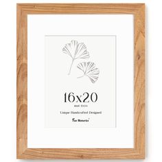 a wooden frame with a drawing of two leaves in the center and text below it