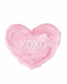 a pink heart with the word xoxo written in white ink on a white background