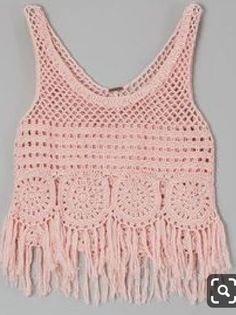 a pink crocheted top with fringes