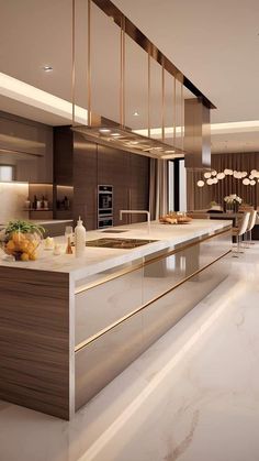 a modern kitchen with marble counter tops and gold trimmings on the cabinets, along with stainless steel appliances