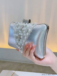 BagForLove - Chic Wedding & Party Clutch: Elegant Faux Pearl & Rhinestone Embellished Accessory Product Description Color Silver Bag Size Mini Pattern Type Plain Type Box Bag Material Iron Size Chart INCH CM Bag Height Bag Length Bag Width 5.5 inch 7.9 inch 2.6 inch Bag Height Bag Length Bag Width 14 cm 20 cm 6.5 cm Details Pictures Similar Products h2 { text-align: center; } /* æ¢è¡ */ li{ white-space: normal; word-break: break-all; word-wrap: break-word; } .red-box { width: 100%; display: fl Chic Wedding Party, Silver Bag, Silver Bags, Party Clutch, Wedding Clutch, Gold Bag, Frame Bag, Rhinestone Embellishments, Word Wrap