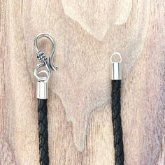 two black leather cord with silver clasps