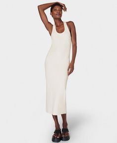 The throw-on midi your wardrobe's been waiting for. A soft, ribbed fabric made with 46% cotton . Slim fit with a flattering stretch and racerback silhouette . Features contrasting binding on the neckline and armholes for a sporty look. Front length: 122cm / 48". Model wears size S and is 178cm/5'10" tall. Style Code: SB9746Colour: Lily White White Knit Tank Dress, Casual White Knit Maxi Dress, White Ribbed Fitted Maxi Dress, White Ribbed Stretch Maxi Dress, Stretch Midi-length Summer Sweater Dress, White Women Dresses, Ribbed Tank Dress, Activewear For Women, Lily White