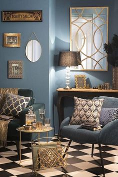 a living room with blue walls and black and white checkered flooring on the floor