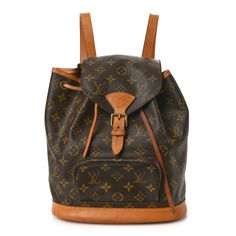 This is the authentic LOUIS VUITTON Monogram Montsouris MM Backpack. This versatile backpack is crafted of classic monogram coated canvas. The bag features a front zipper pocket, and natural vachetta cowhide leather trim including the base, top handle, and adjustable backpack straps. The bag opens with a belt buckle to a cocoa brown fabric interior and a patch pocket. Luxury Coated Canvas Backpack With Leather Handles, Luxury Backpack With Leather Handles And Coated Canvas, Daily Monogram Canvas Backpack With Adjustable Strap, Daily Use Monogram Canvas Backpack With Adjustable Strap, Classic Travel Backpack In Monogram Canvas, Classic Monogram Canvas Travel Backpack, Brown Monogram Canvas Backpack, Monogram Canvas Backpack For Everyday Use, Luxury Coated Canvas Leather Backpack For Daily Use