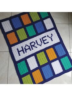 a colorful rug that says harvey on it