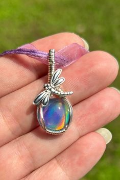 **Please make sure your shipping address is correct. I will not be responsible, nor will I replace your order, please double check.  Gorgeous Aurora Opal Doublet hand wrapped in silver wire, comes with a purple lace/cord necklace, adjustable length. This whimsical pendant is 1.5 inches in height and about 0.5 inch in length. The colors of this stone are truly amazing and forever color changing at any angle! Gift box and jewelry cleaning cloth included. A must have for those who love to make a je Wrapping Stones, Aurora Opal, Jewelry Cleaning, Dragonfly Jewelry, Wire Wrap Pendant, Wire Wrapping Crystals, Wire Wrapping Stones, Jewelry Crystal, Jewelry Wire