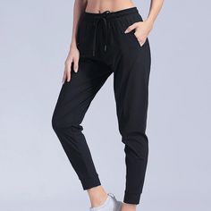 Style: Casual Age: 18-24 Waist Type: high Decoration: Pockets Elasticity: Medium Strecth Fabric Type: Broadcloth Pattern Type: Solid Pant Style: pencil pants Material: nylon Fit Type: regular Length: Ankle-Length Pants Season: Spring/Summer Closure Type: Elastic Waist Gender: WOMEN Front Style: Flat season: spring summer people: female girl women lady occasion: indoor outdoor home High Waist Black Sportswear Bottoms, Black High Waist Sportswear Bottoms, High Stretch Mid-rise Bottoms With Pockets, High-stretch Mid-rise Bottoms With Pockets, Baggy Black Workout Pants, Baggy Black Pants For Workout, Black Baggy Pants For Workout, Black Non-stretch Leggings With Pockets, Black Gym Trousers