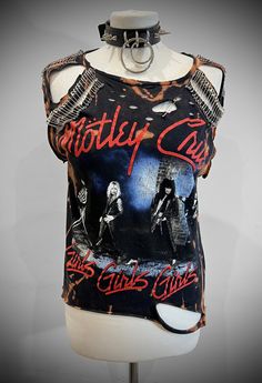 THE STITCHES Distressed Rock collection - This Mötley Crüe T-shirt is a handmade bleached crop top/t-shirt made with a brand new officially licensed band shirt. - Distressed Mötley Crüe  crop top/shirt - Safety pin unisex hand-made crop/tee - Material: Bleached cotton Measurements: Small size (Ready to ship) M, L, XL, XXL Sizes (Made to order: 10 working days process for made to order) Width (armpit to armpit)  S : 18 Inches  M: 20 Inches L: 22 Inches aXL: 24 Inches XXL: 26 Inches 3XL: 28 Inches Edgy Acid Wash T-shirt For Alternative Fashion, Distressed Band Merch Top For Fans, Distressed Rock T-shirt For Streetwear, Stonewashed Band Merch Crew Neck Top, Stonewashed Cotton Band Merch Tops, Edgy Sublimation Print Top For Concerts, Distressed Punk T-shirt, Edgy Distressed Tops For Festival, Edgy Bleached Tops For Streetwear