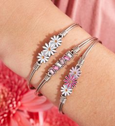 With a little seed of optimism, everything opens up. Channel the sweet simplicity of nature's most down- to- earth flower in this handmade daisy bracelet stack in an ombre array of hues. The pink and white flower bangles pops perfectly against a row of pink ombre crystals to bring the whole look to life. Easy hook and catch closure bracelet that measures 6.5 in. | With a little seed of optimism, everything opens up. Channel the sweet simplicity of nature's most down- to- earth flower in this handmade daisy bracelet stack in an ombre array of hues. The pink and white flower bangles pops perfectly against a row of pink ombre crystals to bring the whole look to life. Easy hook and catch closure bracelet that measures 6.5 in. | 1-800-Flowers Apparel Accessories Accessories Apparel Accessories Flower Bangles, Daisy Bracelet, Letter Beads, Wire Bracelet, Pink Ombre, Photo Bracelet, Gifts For New Moms, White Flower, Bracelet Stack