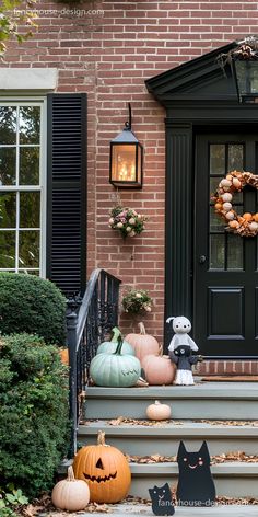 a front porch with pumpkins and decorations on the steps