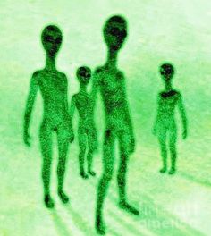 an alien family walking down the street with their shadow on the ground in front of them