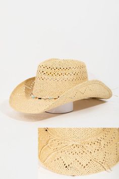 Beaded rope straw braid cowboy hat. This cowboy hat introduces a unique beaded rope straw braid style. Celebrate the art of accessorizing with this piece that effortlessly encapsulates modern trends. Material Contents: 100% Paper. Made in: Imported Bohemian Braided Hat Bands For Rodeo, Bohemian Natural Straw Hat For Western-themed Events, Adjustable Beaded Western Straw Hat, Western Braided Sun Hat For Rodeo, Country Style Woven Straw Hat For Rodeo, Adjustable Beaded Straw Hat For Country Events, Adjustable Beige Straw Hat For Ranch, Spring Straw Sun Hat For Western-themed Events, Western Style Woven Straw Hat Band