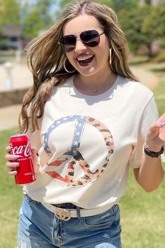 Spread love and peace this summer with this Patriotic Leopard Peace Sign Bella Canvas Tee! It is so cute with our denim shorts! Summer Crew Neck Top With Peace Sign, Casual Peace Sign Summer Top, Soft-washed Tops For Spring And Summer, Casual Cotton T-shirt With Peace Sign, Casual Short Sleeve Tops With Peace Sign, Spring Vacation Soft-washed Tops, Peace Sign Shirts, Patriotic Tees, Love And Peace