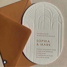 the wedding stationery is designed to look like art deco