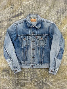 1970s Levi's Type 3 Big E Denim Trucker Jacket - Size 40 (tagged) (check measurements) Measurements (inch/cm) - Pit to pit: 19.5 inch / 49.5 cm - Length: 22.5 inch / 57 cm - Sleeve: 23.5 inch / 59.5 cm - Blue colour. Hole on neck and sleeves, please check pictures for further inspection! '350' serial number on buttons. Big E as seen on red Levi's tab. 1970s era design and tags. - All items are second hand and vintage so please expect signs of wear! - No refunds or returns! - DM with any further Retro Faded Denim Jacket With Pockets, Vintage Fitted Selvedge Denim Jacket, Vintage Denim Jacket With Relaxed Fit And Pockets, Vintage Faded Outerwear With Pockets, Vintage Fitted Denim Jacket With Patch Pockets, Vintage Selvedge Denim Jacket For Fall, Vintage Denim Jacket With Patch Pockets For Fall, Vintage Selvedge Denim Jacket, Fitted Vintage Faded Denim Jacket