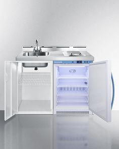 an open refrigerator with the door ajar and water dispenser in it