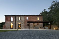 a large brick house with an open patio