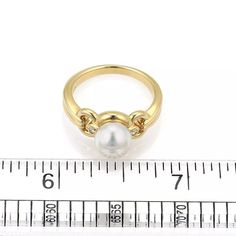 Material: 18k yellow gold  Measurement: 0.54" across x 0.33" wide x 0.34" high  Diamond: 3 points total  Pearl: Akoya 7.5mm  Ring size: 6  Weight:  6 grams    This gorgeous authentic ring is by Mikimoto, well crafted from 18k yellow gold with a polished finish featuring a lustrous 7.5mm Akoya pearl accented on each side with a small round cut diamond. Slim shank with a grooved band. Signed M K18. Yellow Gold Cocktail Ring, Gold Cocktail Ring, Gold Cocktail, Akoya Pearls, Pearl Diamond, Cocktail Ring, Round Cut Diamond, Cocktail Rings, Round Cut