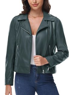 a woman wearing a green leather jacket with zippers on the shoulders and shoulder straps